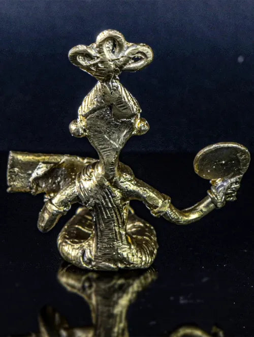 Bengal Dokra Adivasi girl reading book with hand fan in hand