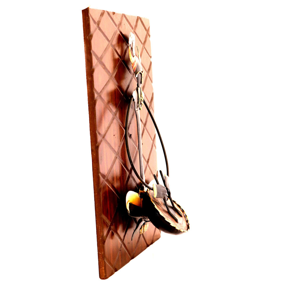 Sitting Maadia playing instruments wall hanging