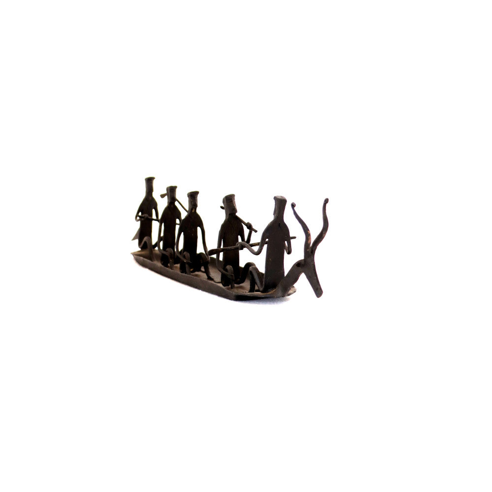 Tribal group on boat with Deer head