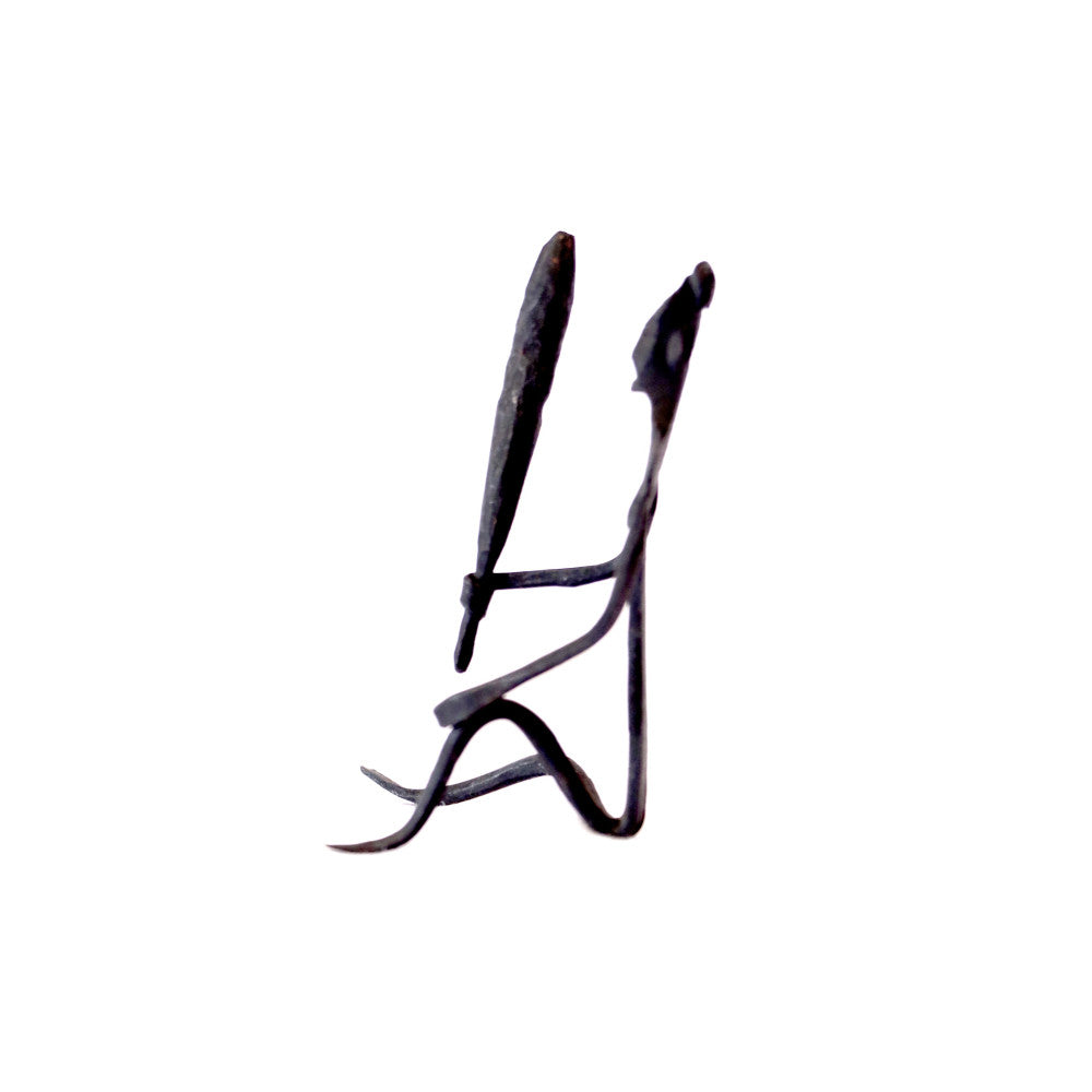 Tribal lady grinding grains