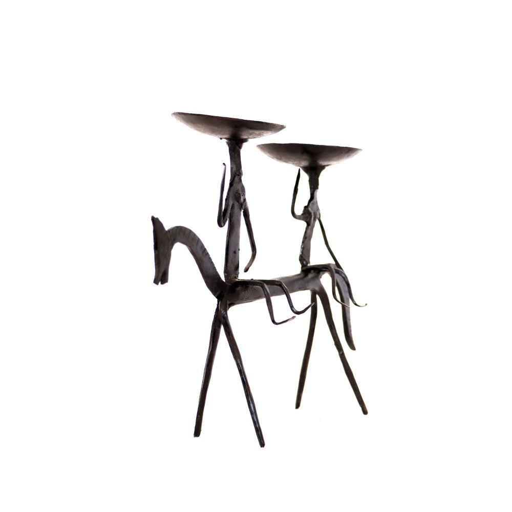 Two tribal men riding on horse candle stand